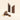 Two chocolate bars stand upright behind a pile of broken chocolate pieces and scattered hazelnuts. One bar has the word “VENCH” embossed on it, and both bars have layers of filling visible. The background is plain and light-colored. - AI generated text