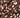 Close-up of a dark chocolate bar with whole almonds embedded throughout, showing the rich brown color of the chocolate and the creamy white almonds. The surface appears textured and slightly glossy. - AI generated text