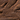 Close-up of rich, dark chocolate with textured swirls and sprinkled with coarse golden sugar crystals, creating a luxurious and indulgent appearance. - AI generated text
