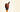A chocolate ice cream cone with chocolate sprinkles, topped with two scoops of chocolate ice cream, more chocolate sprinkles, and a small piece of chocolate bar, set against a plain light background. - AI generated text
