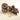 A jar of Venchi Nocciolata dark chocolate hazelnut spread sits next to pieces of dark chocolate with whole hazelnuts and several loose hazelnuts on a light surface. - AI generated text