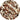 Close-up of creamy white ice cream swirled with generous ribbons of dark chocolate, creating a marbled texture and rich, contrasting patterns throughout. - AI generated text