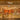 A brightly lit Venchi chocolate and gelato store features colorful displays of chocolates and treats, elegant gold accents, and modern decor with a warm, inviting atmosphere. - AI generated text