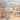 A brightly lit Venchi chocolate store with a modern glass and metal exterior, an orange display shelf with chocolate products, and colorful shelves and counters inside the shop. - AI generated text
