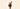 Gelato cone with pink "Sicilian Blood Orange" and brown "Piedmont Hazelnut" scoops, chocolate, sprinkles, nuts; soft background. Ice cream cone with pink and brown scoops, chocolate piece, sprinkles, and nuts set against a soft background. - AI generated text