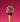 A waffle ice cream cone with a chocolate-coated rim, topped with a scoop of pink ice cream, chocolate sprinkles, red syrup, and a round chocolate coin, set against a bright pink background. - AI generated text