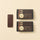 An elegant arrangement of six Dark ChocoBiscuit Snacks and one unwrapped bar with a gluten-free wafer on a soft beige backdrop. - AI generated text