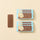 A Milk ChocoBiscuit Snacks Bunde bar and six elegantly wrapped gluten-free bars rest on a beige background. - AI generated text