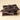 A stack of thick, glossy 85% Dark Chocolate Bar Bundle bars on a light surface, with VENCHI embossed on the top bar.